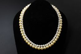 A TWO STRAND CULTURED PEARL NECKLACE