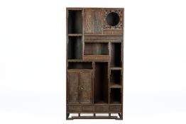 A LARGE CARVED HARDWOOD DISPLAY CABINET