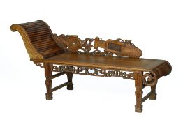 A CARVED HARDWOOD CHAISE LONGUE