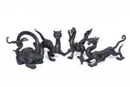 A SET OF FOUR METALWARE MODELS OF MYTHICAL BEASTS