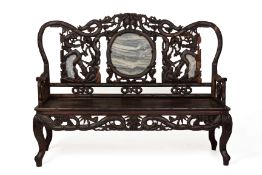 A MARBLE INSET CARVED HARDWOOD SETTEE