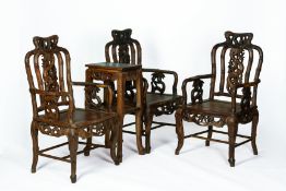 A SET OF BAMBOO CARVED HARDWOOD TABLE AND CHAIRS