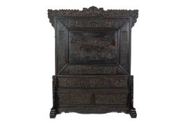 A LARGE CARVED HARDWOOD SCREEN