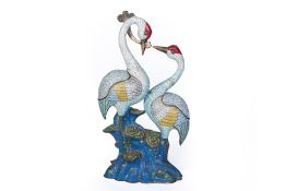 A CLOISONNE ENAMEL MODEL OF A PAIR OF CRANES