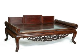 A LARGE CARVED HARDWOOD DAYBED