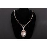 A SILVER AND MOTHER OF PEARL PENDANT AND CHAIN