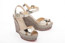 A PAIR OF LOUBOUTIN GOLD ESPADRILLE WEDGES EU41