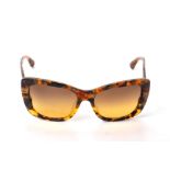 A PAIR OF MIU MIU TORTOISESHELL SUNGLASSES