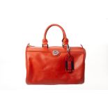 A LONGCHAMP CORAL ORANGE HANDBAG