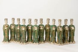 A SET OF TWELVE GREEN GLAZED POTTERY ZODIAC FIGURES