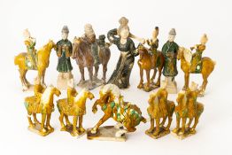 A GROUP OF TANG STYLE POTTERY FIGURES AND HORSES