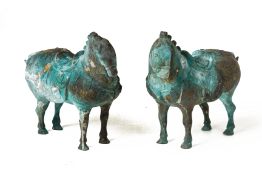 A PAIR OF TANG STYLE METALWARE MODELS OF HORSES