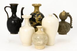 A GROUP OF SIX CHINESE CERAMIC EWERS AND VASES