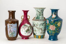 A GROUP OF FOUR POLYCHROME DECORATED PORCELAIN VASES