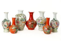 A GROUP OF WHITE AND CORAL GROUND FAMILLE ROSE VASES