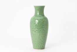 A MOULDED CELADON PORCELAIN 'DRAGON' VASE