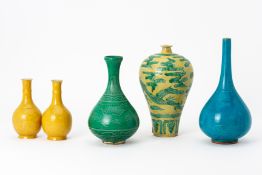 A GROUP OF FIVE INCISED PORCELAIN VASES