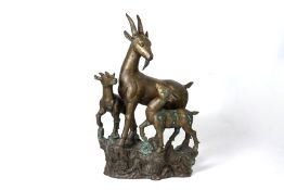 A LARGE METALWARE MODEL OF THREE IBEX