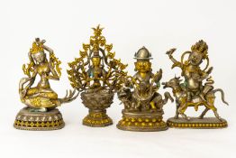 A GROUP OF FOUR CAST METAL BUDDHIST FIGURES