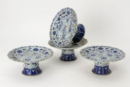 A SET OF FOUR BLUE AND WHITE PORCELAIN TAZZAS