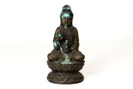 A METALWARE FIGURE OF GUANYIN