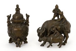 A CAST METALWARE CENSER AND A BOYS AND BUFFALO GROUP