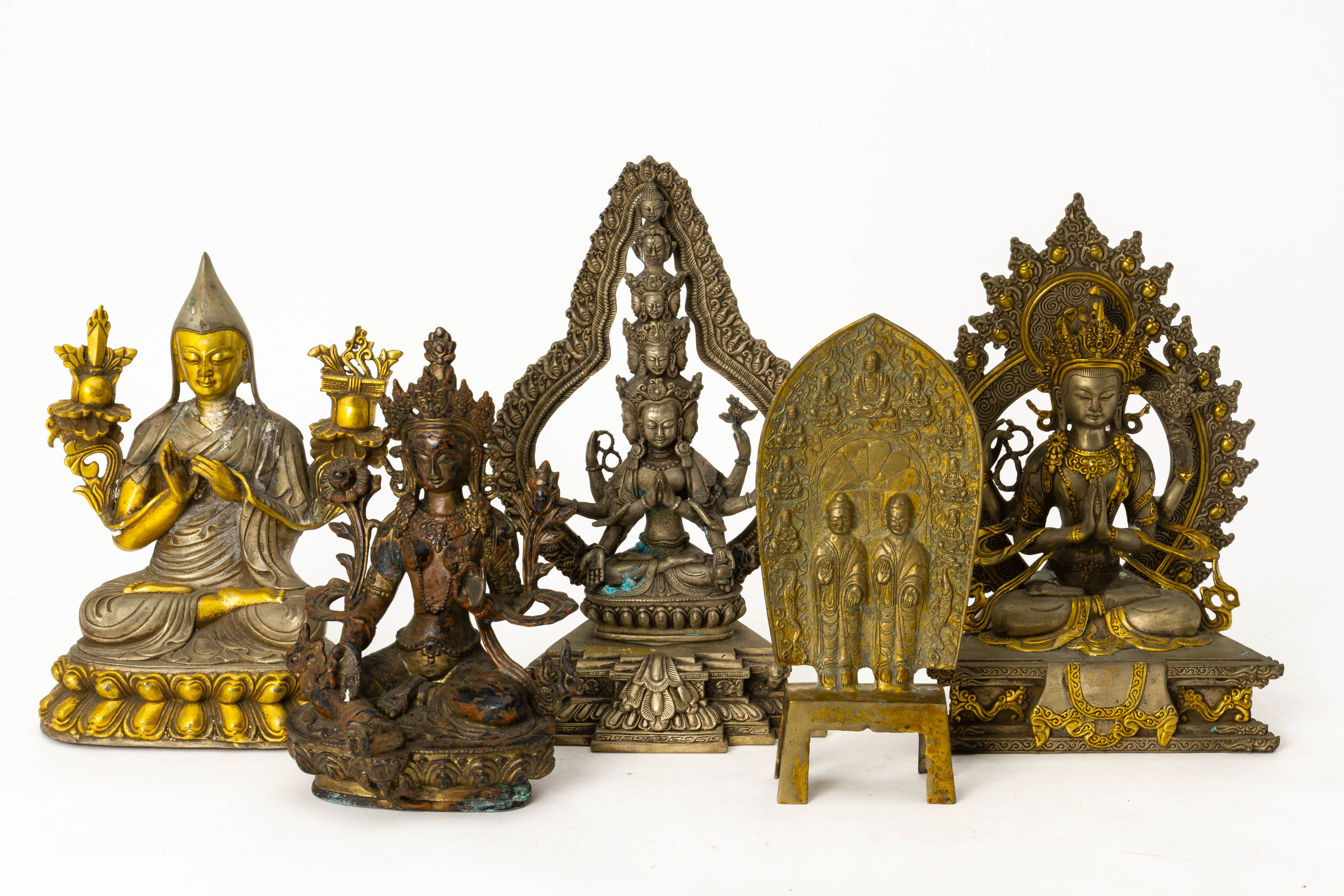 A GROUP OF FIVE CAST METAL BUDDHIST FIGURES