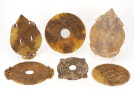 A GROUP OF SIX ARCHAIC STYLE CARVED STONE BI DISCS