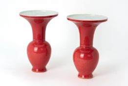 A PAIR OF RED MONOCHROME GLAZED PORCELAIN SPITOONS