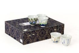 A SET OF TWELVE KANGXI STYLE MONTHS OF THE YEAR WINE CUPS