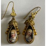 Pair of Antique Yellow Metal and Porcelain Earrings - 52mm x 12mm with portraits of ladies.