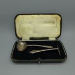 A silver spoon and pusher christening set, 38g, cased, spoon a/f