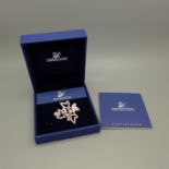 A Swarovski brooch, boxed