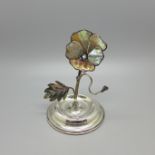 A silver and mother of pearl set ring stand