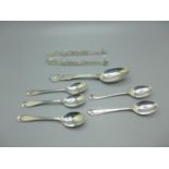 A William IV silver spoon, London 1834, five silver spoons and a pair of silver sugar bows, 134g