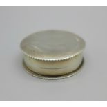 A Victorian circular silver pill box with gilt interior, Chester 1898, top dented, 34mm diameter