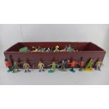 A box of Britains plastic soldiers, cowboys, Swopits, etc.
