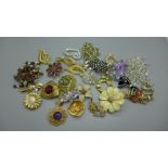 Thirty costume brooches