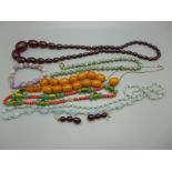 A sherry amber bead necklace, a pair of similar earrings and other bead jewellery