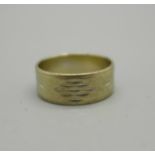 An 18ct white gold wedding band, 4.2g, K, marked 750