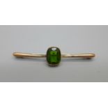A 9ct gold and green stone brooch with steel pin, 2.3g, boxed