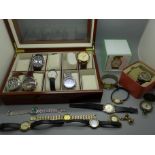 A collection of wristwatches including three Accurist, Skagen, a watch display box, etc.