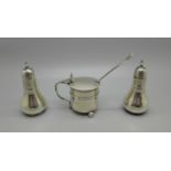 A pair of silver pepper pots and a silver mustard pot and spoon, 100g