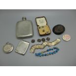 A silver matchbook holder and a silver compact, jewellery and a pewter flask