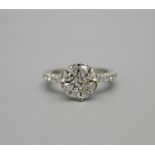 An 18ct gold, seventeen stone diamond cluster ring, total diamond weight 80pts, 4g, size K½