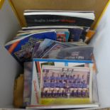 A collection of sports programmes and leaflets including football and rugby, some signed