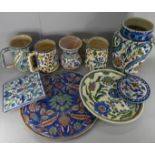 A collection of pottery including Palestinian; jugs, mugs and plaques