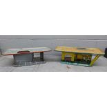 Two 1960's tin plate garage service stations