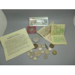 A £1 note, commemorative crowns and coins