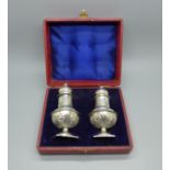 Two silver pepper pots, 65g, boxed